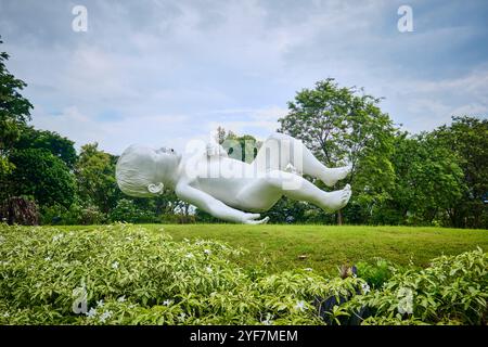 Singapore - August 16, 2024: Marc Quinn's Planet sculpture (floating baby) in Gardens by the Bay Stock Photo