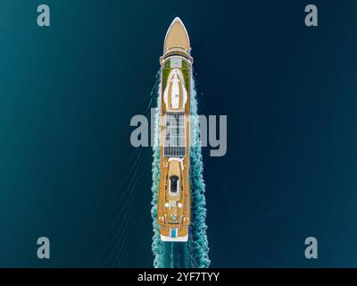 Top-down shot of a modern cruise liner cutting through the ocean waves Stock Photo