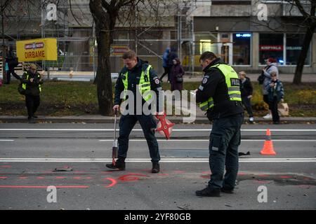 Police officers and firefighters are working at the accident site. A major traffic accident occurred in Vilnius, involving a collision of three cars, with more than 10 people injured. Stock Photo