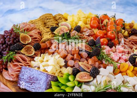 Close up of charcuterie board with cheese, fig, and crackers. Stock Photo