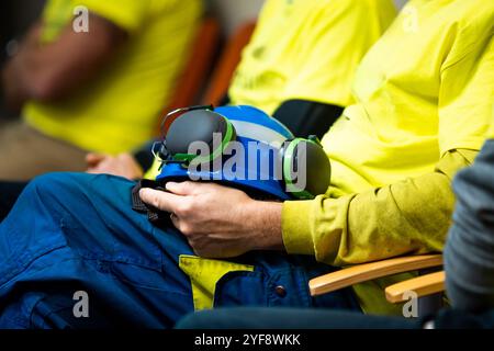 Man with construction helmet in his hands. Stock Photo