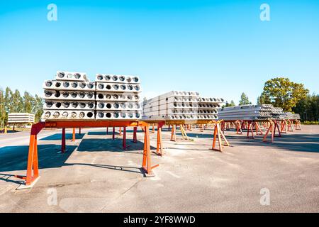 Stack of precast reinforced concrete slabs in a house-building factory workshop Stock Photo