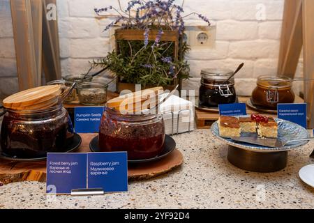 Assorted Jams and Spreads for Breakfast Buffet with Fresh Pumpkin Seeds and Breads in hotel Stock Photo