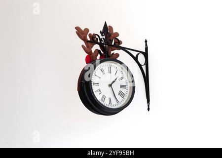 Close-up detail of black old city clock in home interior on white background. Horizontal Stock Photo