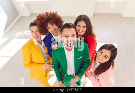 Group Portrait Of Young People In Colorful Business Suits Stock Photo
