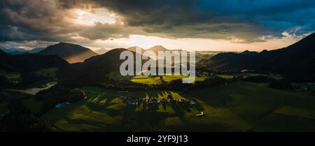Golden Sunset Casting Warm Light Over Rolling Hills in the Austrian Countryside Stock Photo