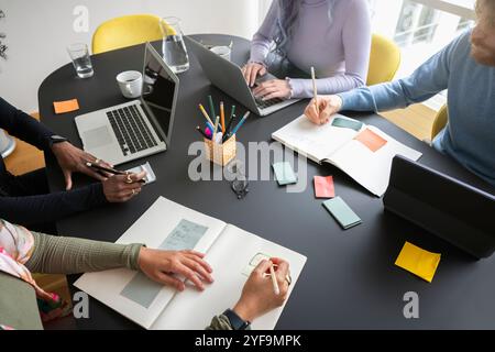 High angle view of male and female business professionals working in conference room Stock Photo