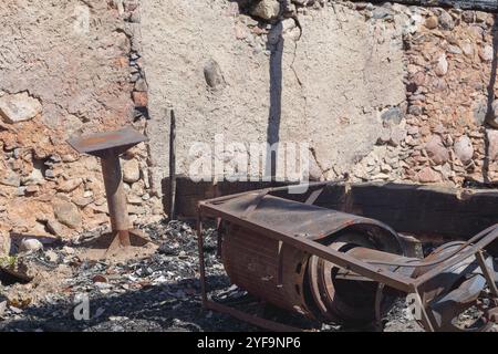 old metal things in a burnt boulder house Stock Photo