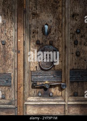 Old weathered oak door and metal door furnishings, church of St Mary, Hadleigh, Suffolk, UK Stock Photo