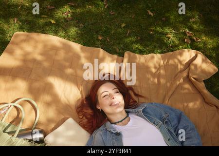 High angle view of young woman resting at park Stock Photo
