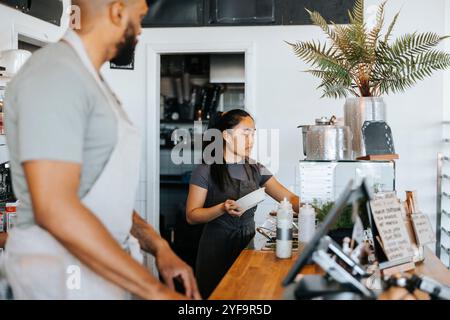 Two barista working in cafe Stock Photo