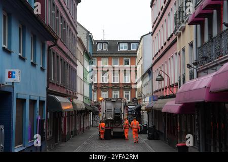 Hamburg, Germany. 04th Nov, 2024. A garbage truck drives through Herbertstraße in the St. Pauli district and empties the garbage cans. Credit: Marcus Brandt/dpa/Alamy Live News Stock Photo