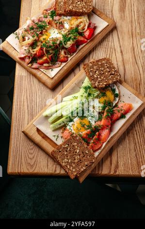 fried eggs with vegetables and bread on a plate Stock Photo