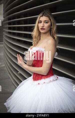 Ballerina wearing high heels and christmas dress posing outdoors. Dancing outdoor Stock Photo