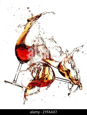 Red wine in glasses with splashes on a white background Stock Photo