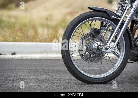 Motorbike front wheel close-up, outdoor on street. bike riding. Close up front wheel of a motorcycle Stock Photo