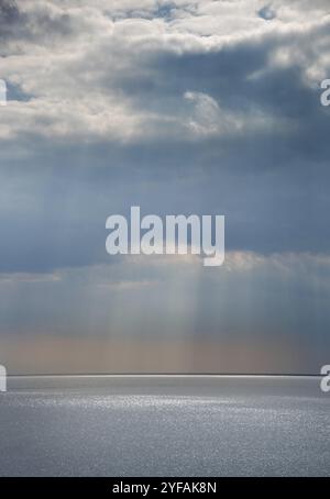Stormy sky with dramatic clouds above the sea. Stormy weather at the ocean Stock Photo