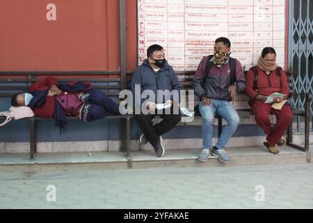 Kathmandu, Nepal, 16 March 2020: People wearing protecting masks outside a hospital, waiting for checkup for coronavirus and other health diseases at Stock Photo