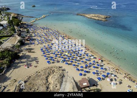 Aerial drone photograph of fig tree bay beach. with tourists relaxing and enjoying summer vacations cyprus Stock Photo