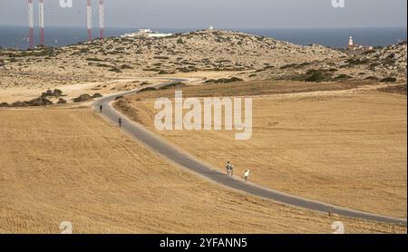 Cape Greko, Cyprus, June 08 2020: Tourist people trekking on a road at Cape Greko peninsula Paralimni area in Cyprus, Europe Stock Photo