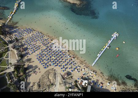 Aerial drone photograph of fig tree bay beach. with tourists relaxing and enjoying summer vacations cyprus Stock Photo