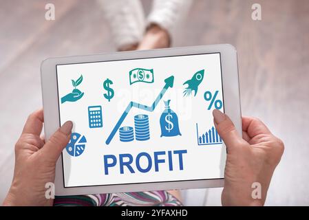 Profit concept shown on a tablet held by a woman Stock Photo