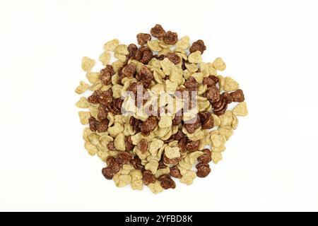 Pile of mixed black and white cornflakes isolated on white background. Stock Photo