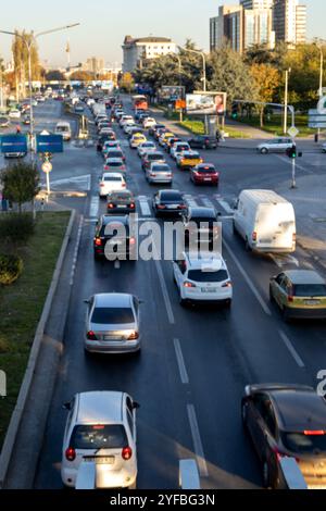 Blurred motion of cars on the motorway. Big traffic in the city. Urban highway filled out cars. Rush hours. Top view. Front and back view of traffic. Stock Photo