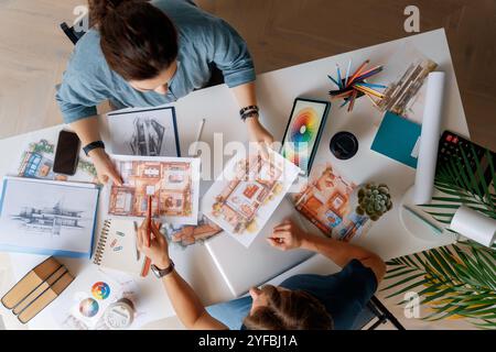 Designers working in studio and sketching. Stock Photo