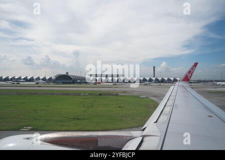 BANGKOK, THAILAND - OCTOBER 26, 2023: Suvarnabhumi International Airport as seen from AirAsia airplane at daytime. Stock Photo