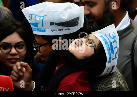 A young supporter of Aam Aadmi Party (AAP) dressed as Delhi's Chief Minister Arvind Kejriwal celebrates victory in regional elections in India's capital New Delhi on 11 February 2020. AAP supporters gathered and celebrated across New Delhi mainly at party head office after the sweeping win against the Prime Minister of India Narendra Modi's party. Stock Photo