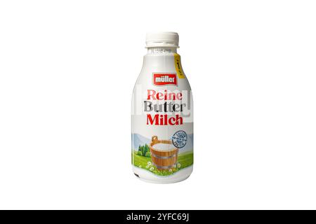 Germany Berlin November 4, 2024. A bottle of Reine Butter Milch is shown on a white background. The bottle is white and has a red label Stock Photo