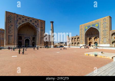 The Ulugbek Madrasah and Tilya Kori Madrasah are part of Ensemble of Registan in historic center at the heart of Samarkand, Uzbekistan. Stock Photo