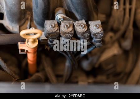 Close-Up of Engine Fuel Injector Assembly in a Vehicle. Stock Photo