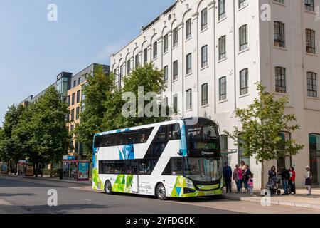 A queue of people are waiting to board the Park and Ride double decker bus from Trumpington to Cambridge town centre. England, UK Stock Photo