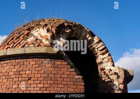 The dilapidated tower of the Bobruisk fortress made of red brick Stock Photo
