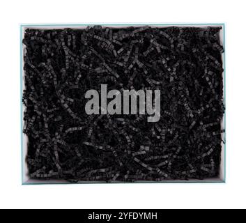 Top view of empty open gift box with black color shredded paper - gift box filler. Luxury present wrapping or products background. Isolated on white. Stock Photo