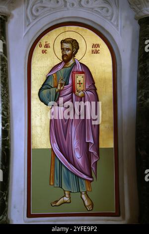 Icon of Saint Luke The Evangelist holding the Gospels in Saints Constantine and Helen Greek orthodox church Lazaraki Glyfada Athens Attica Greece Stock Photo