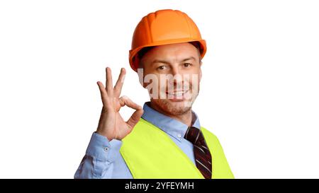 Cheerful Builder In Uniform Gesturing Ok On White Background, Panorama Stock Photo