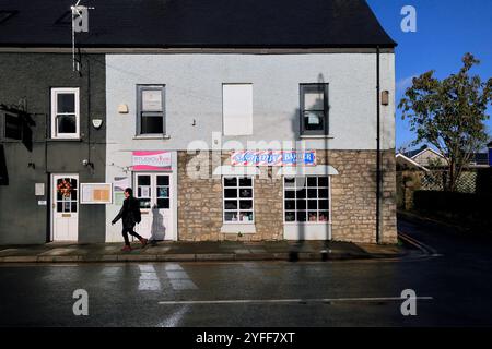 Barber shop with upside down sign, Cowbridge High Street, Vale of Glamorgan, South Wales, UK. Autumn November 2024 Stock Photo