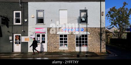 Barber shop with upside down sign, Cowbridge High Street, Vale of Glamorgan, South Wales, UK. Autumn November 2024 Stock Photo