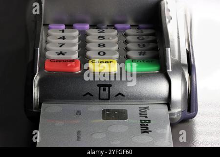 payment terminal with generic bank card on counter Stock Photo