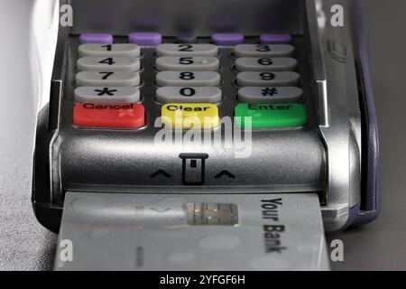 payment terminal with generic bank card on counter Stock Photo