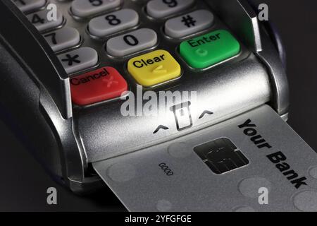 payment terminal with generic bank card on counter Stock Photo