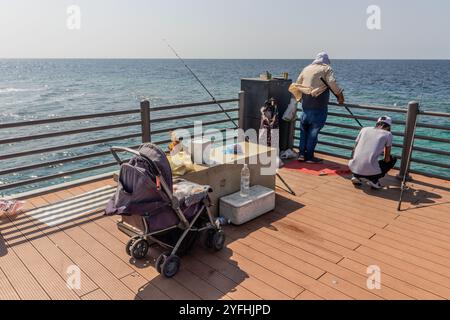 JEDDAH, SAUDI ARABIA - NOVEMBER 16, 2021: Fishermen at corniche promenade in Jeddah, Saudi Arabia Stock Photo