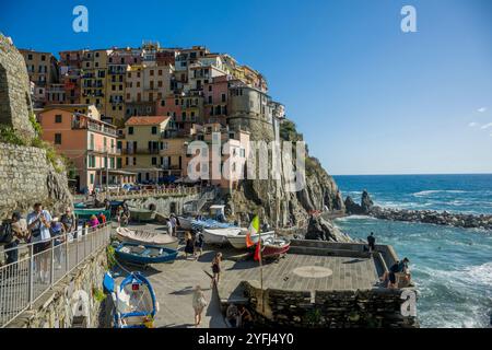 View of colorfulm houses around the tiny harbor of Manarola, Cinque Terre, province of La Spezia, part of the region of Liguria, Northern Italy. Stock Photo