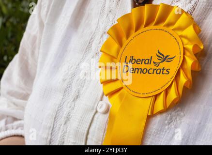 Reading, England – JULY 4 2024: Rosette on a Liberal Democrat Representative, UK General Election Stock Photo