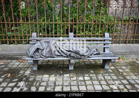 Homeless Jesus sculpture outside the St Magdalene's Church (Madeleine in Brugge) – Bruges, Belgium – 21 October 2024 Stock Photo
