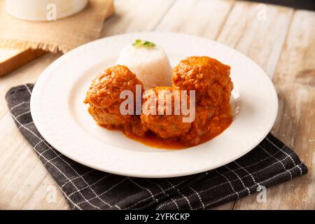 Meatballs in red chipotle chili and tomato sauce, ground pork or beef stuffed with cheese. A very popular homemade food recipe in Mexico and other cou Stock Photo