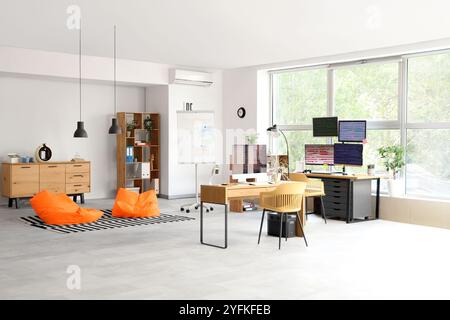 Interior of light programmer's office with desks and beanbags Stock ...